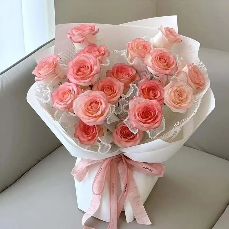 White Floral Packaging for Bouquets Including Decorative Mesh Wrapping