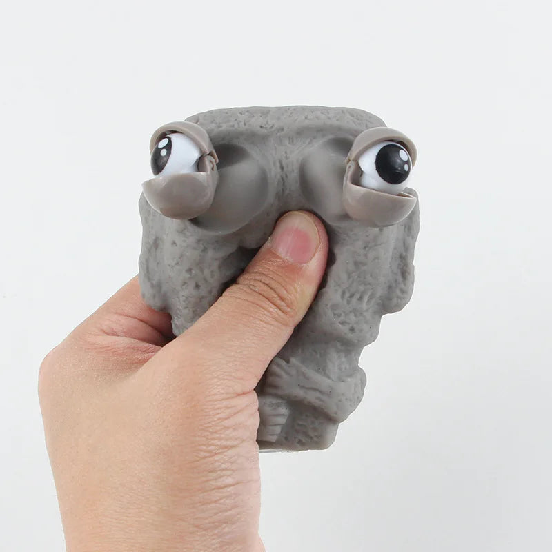 Stone man releases stress toy slowly rebounds soft Moai statue squeeze