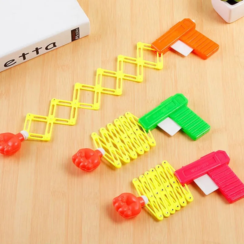 Retractable Fist Shooter Trick Toy Gun Funny Child Prank Toys Kids