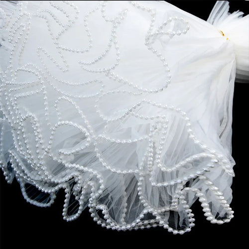 White Floral Packaging for Bouquets Including Decorative Mesh Wrapping