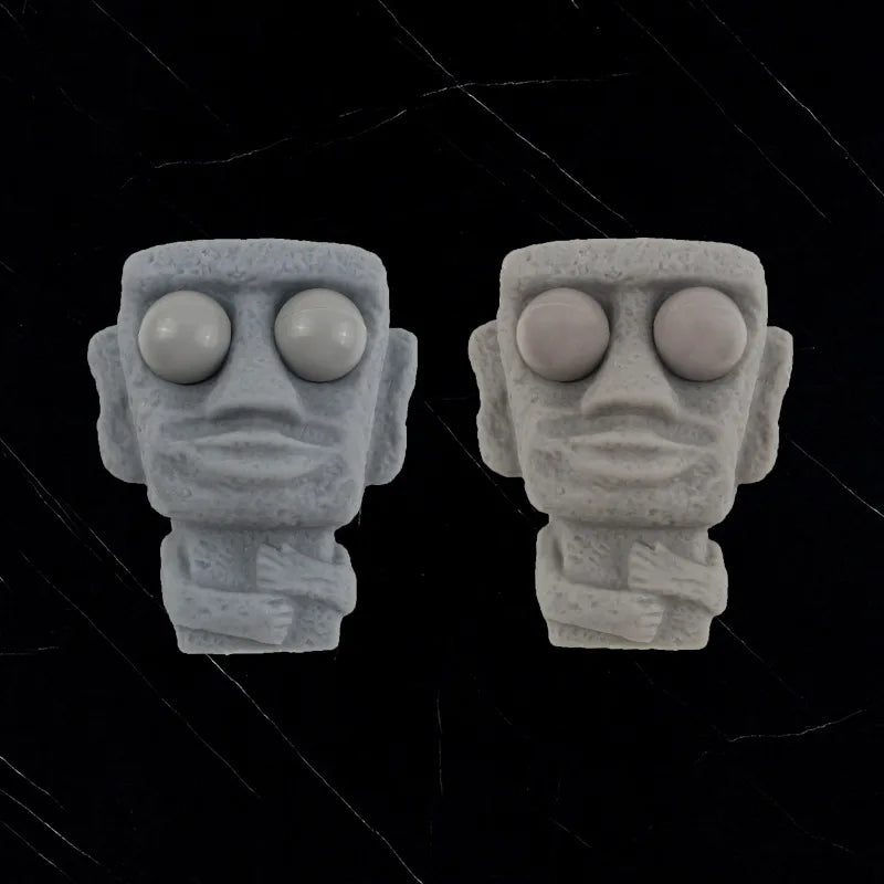 Stone man releases stress toy slowly rebounds soft Moai statue squeeze