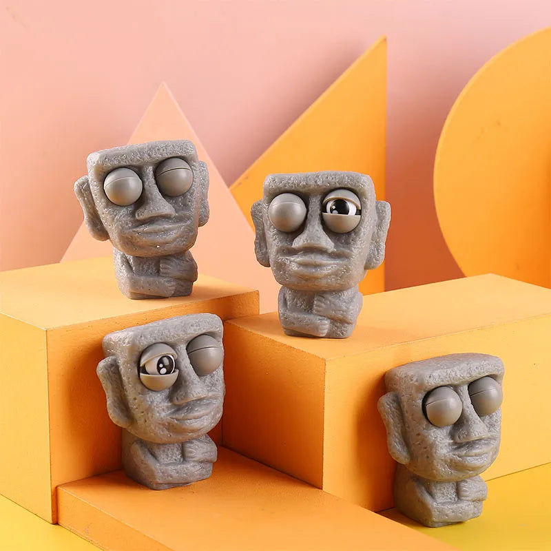 Stone man releases stress toy slowly rebounds soft Moai statue squeeze