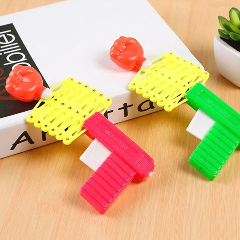 Retractable Fist Shooter Trick Toy Gun Funny Child Prank Toys Kids